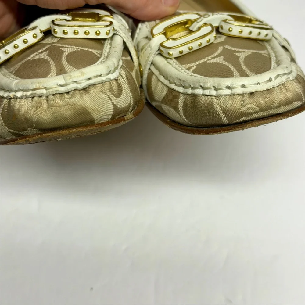 Coach Ella loafers in a gold and white signature monogram canvas. Size 6.5